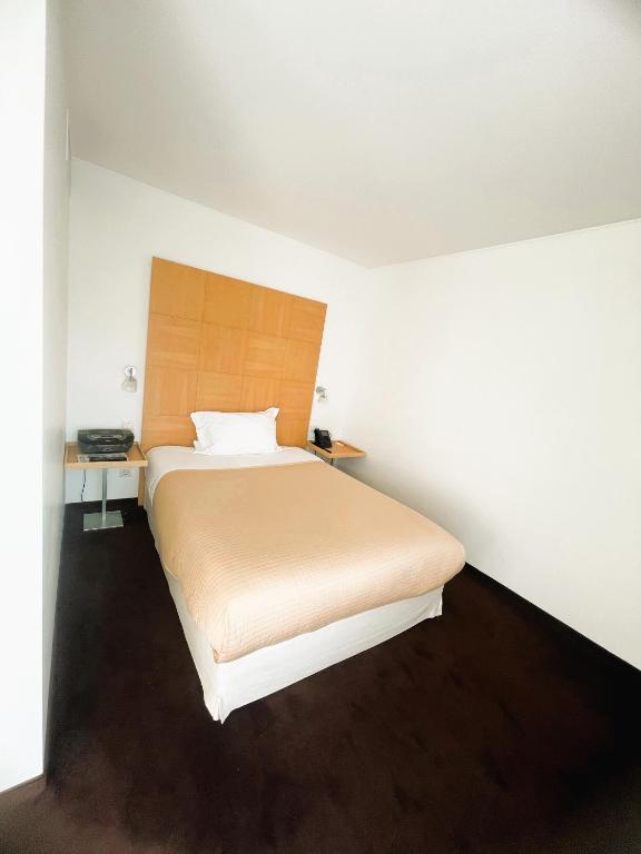 Postel nebo postele na pokoji v ubytování Hotel Alzinn