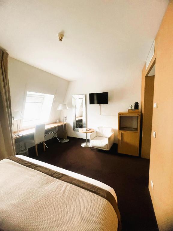 Postel nebo postele na pokoji v ubytování Hotel Alzinn