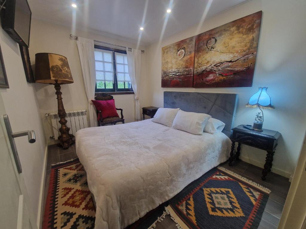 Ένα ή περισσότερα κρεβάτια σε δωμάτιο στο Quinta do Reijaço
