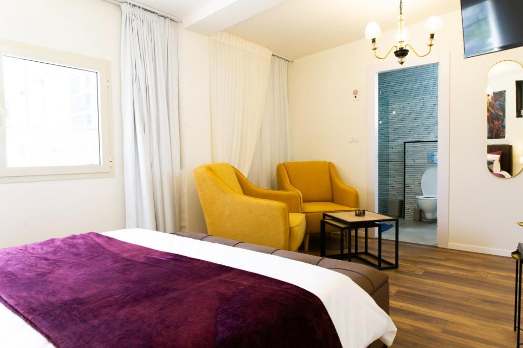 Postel nebo postele na pokoji v ubytování One Apartments TLV