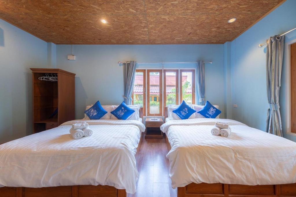 Postel nebo postele na pokoji v ubytování Seafar Resort