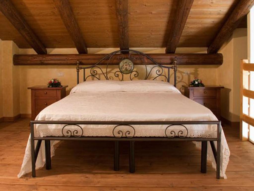 Postel nebo postele na pokoji v ubytování Agriturismo la Cavallina
