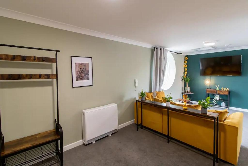 a living room with a couch and a table at 17 Bowline · Superb Studio Free Parking Pass the Keys in Hartlepool