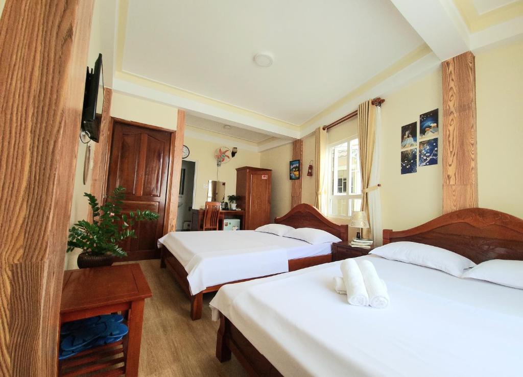 Postel nebo postele na pokoji v ubytování Bình Đào Hotel - Khách sạn ngay trung tâm giá rẻ