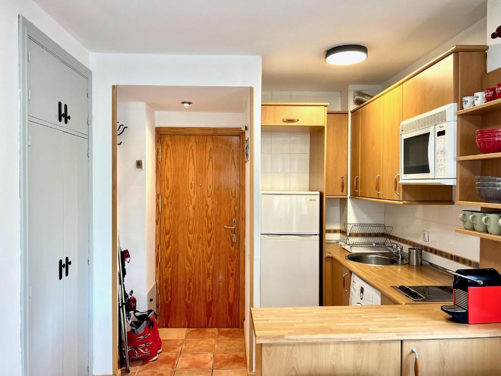 Kuchyň nebo kuchyňský kout v ubytování Apartamento en Formigal con vistas