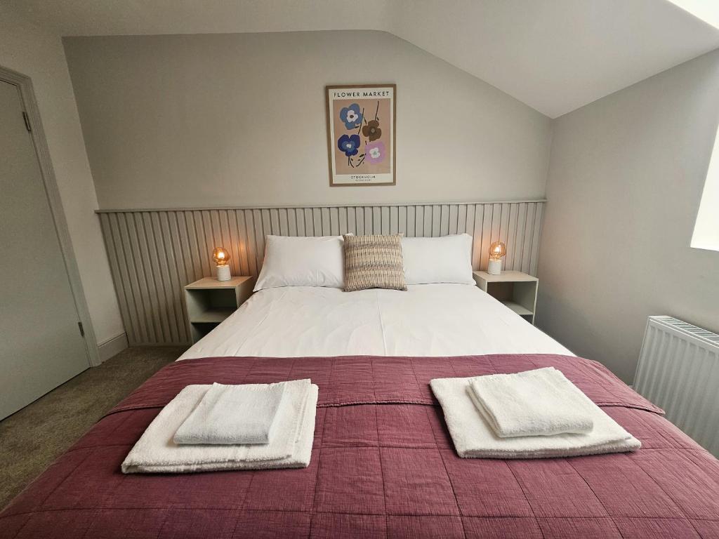 Postel nebo postele na pokoji v ubytování Tatlers Guest House