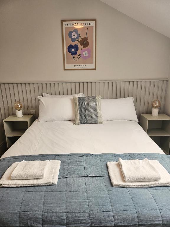 Postel nebo postele na pokoji v ubytování Tatlers Guest House