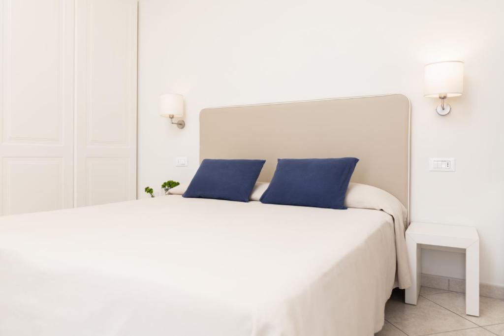 Postel nebo postele na pokoji v ubytování Hotel Capanni