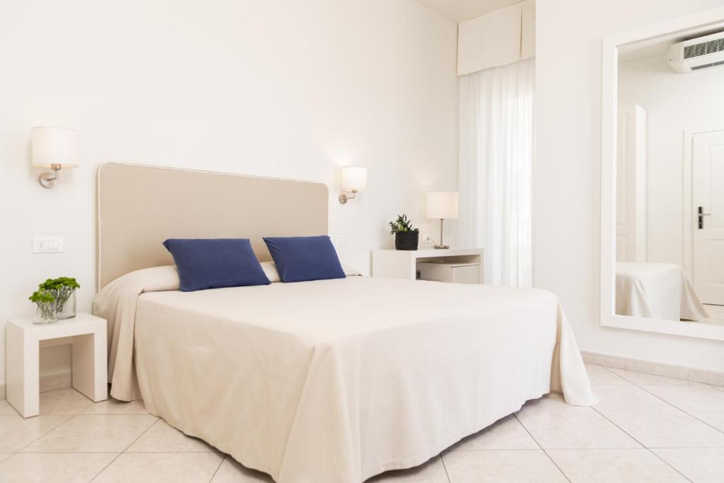 Postel nebo postele na pokoji v ubytování Hotel Capanni