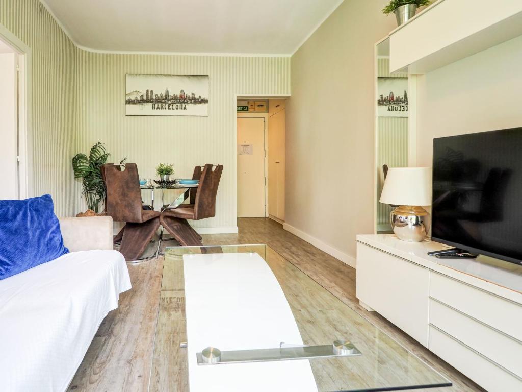 Televízia a/alebo spoločenská miestnosť v ubytovaní Pura Vida Apartment by Hello Homes Sitges