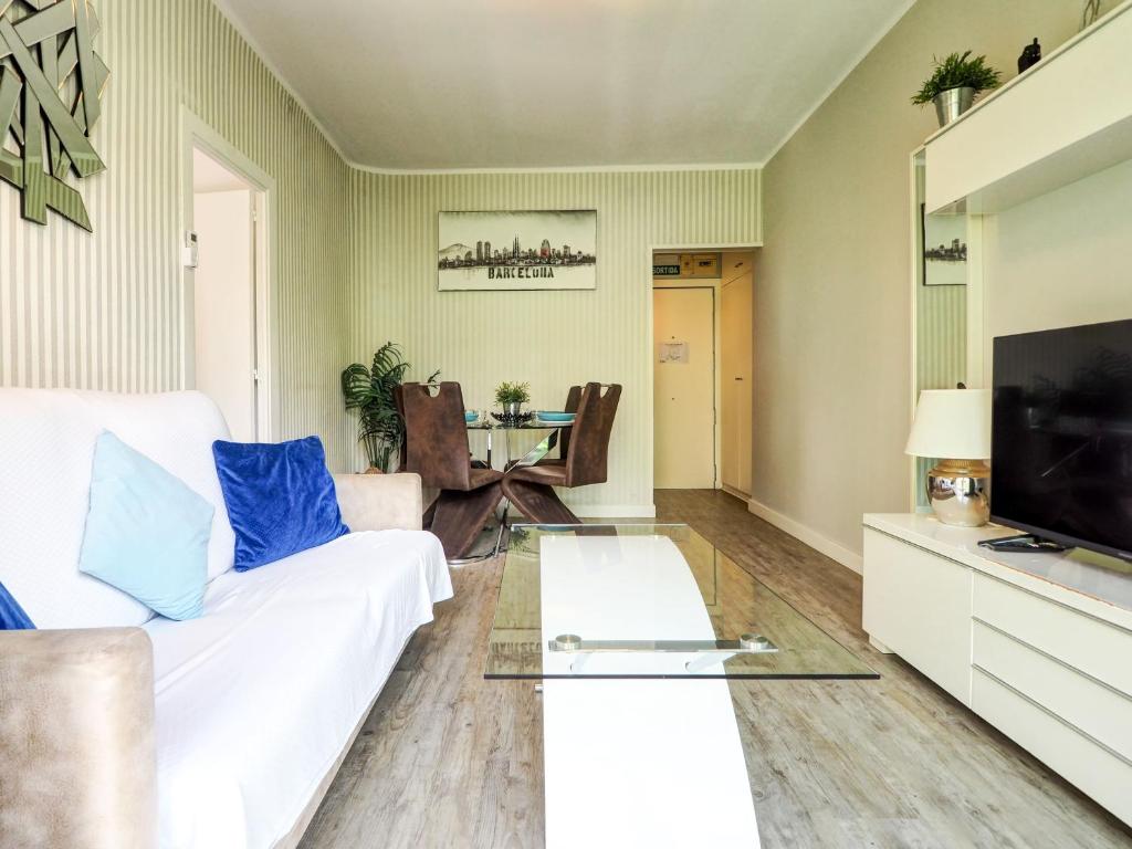 Televízia a/alebo spoločenská miestnosť v ubytovaní Pura Vida Apartment by Hello Homes Sitges