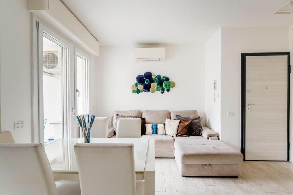 a living room with a couch and balloons on the wall at Brand new 3 bedrooms apartment in Navigli area in Milan