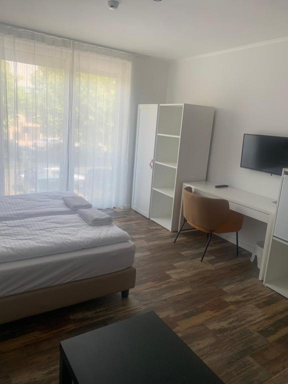 Posteľ alebo postele v izbe v ubytovaní City panzió