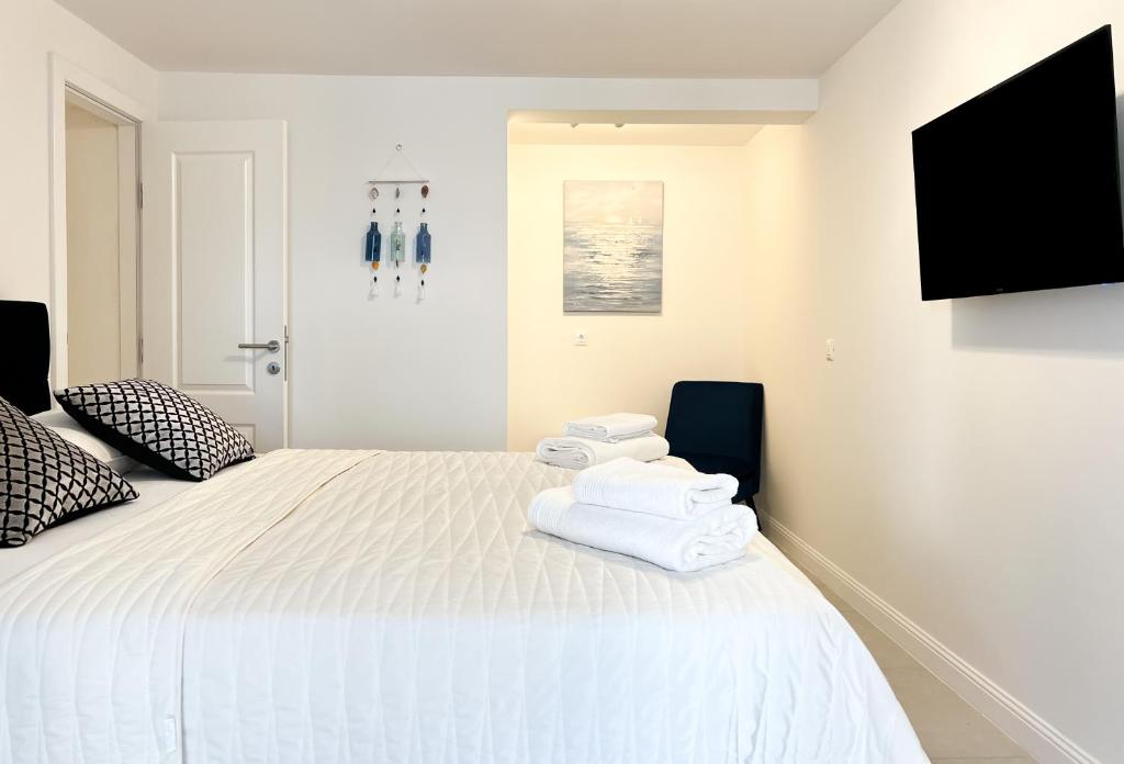 Postel nebo postele na pokoji v ubytování Apartments Larus
