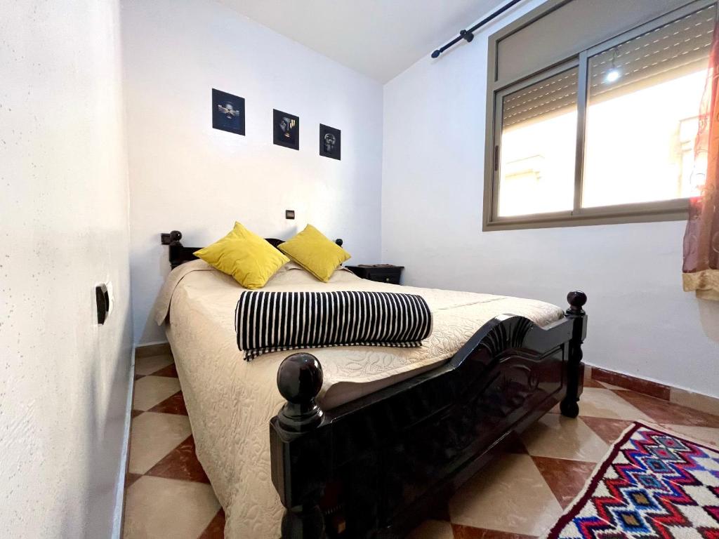 Ένα ή περισσότερα κρεβάτια σε δωμάτιο στο Agadir House