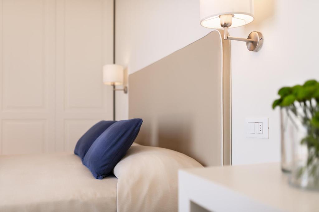Postel nebo postele na pokoji v ubytování Hotel Capanni