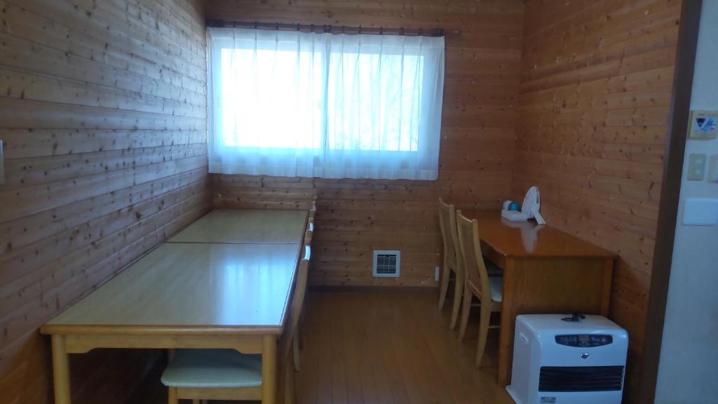 Postel nebo postele na pokoji v ubytování グレース