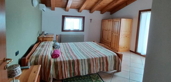 Postel nebo postele na pokoji v ubytování Alloggio agrituristico Zambon