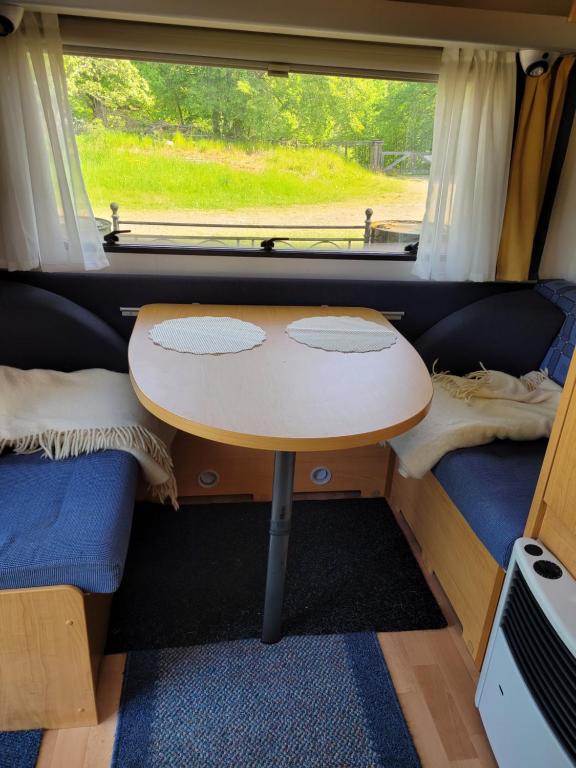 Posezení v ubytování Blankaholm husvagn Knaus