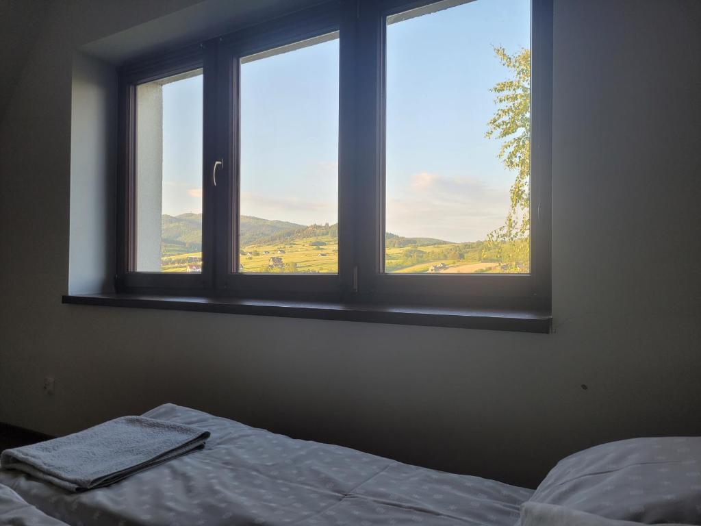 Posteľ alebo postele v izbe v ubytovaní Domki Pod Zamkami