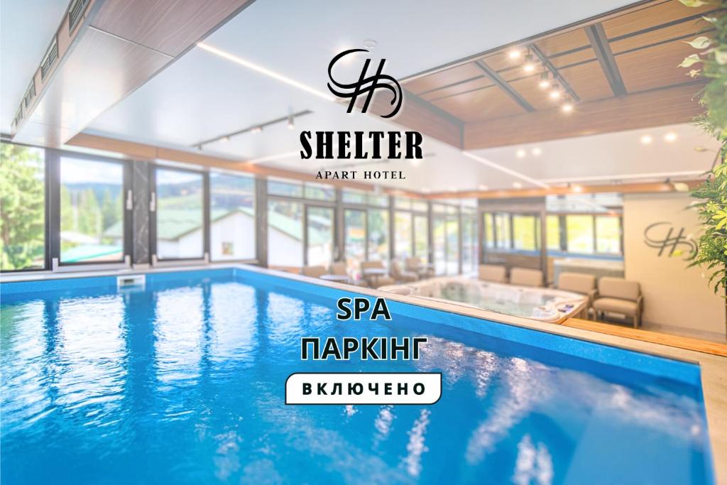 a swimming pool in a house with a sign that reads spa tikiiki at Shelter Apart Hotel in Bukovel