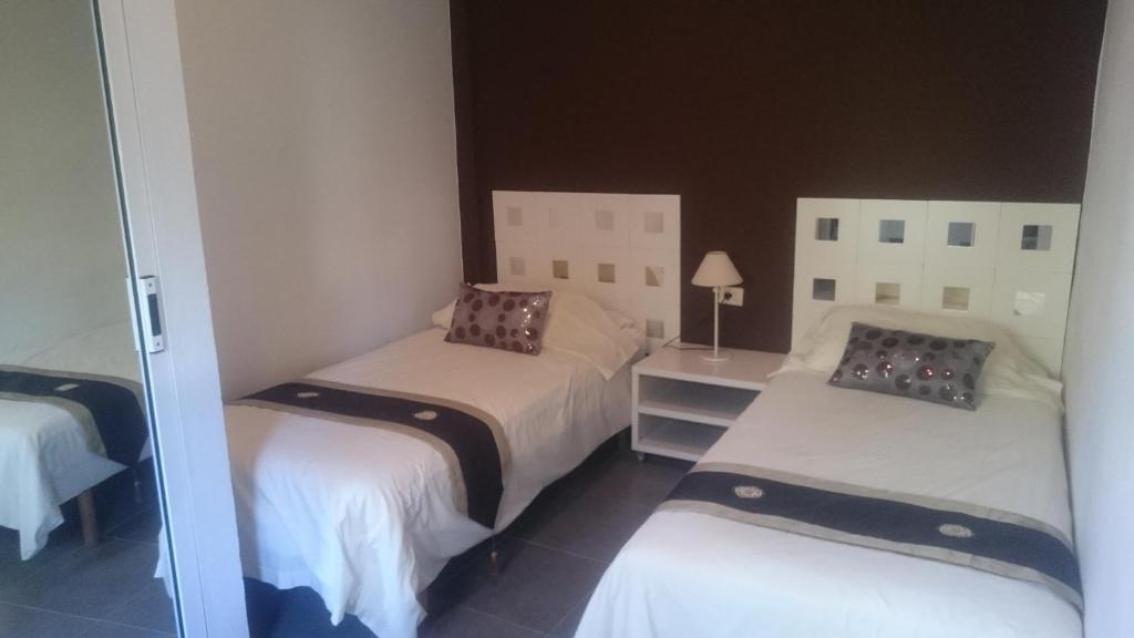 Postel nebo postele na pokoji v ubytování Apartamentos El Patio