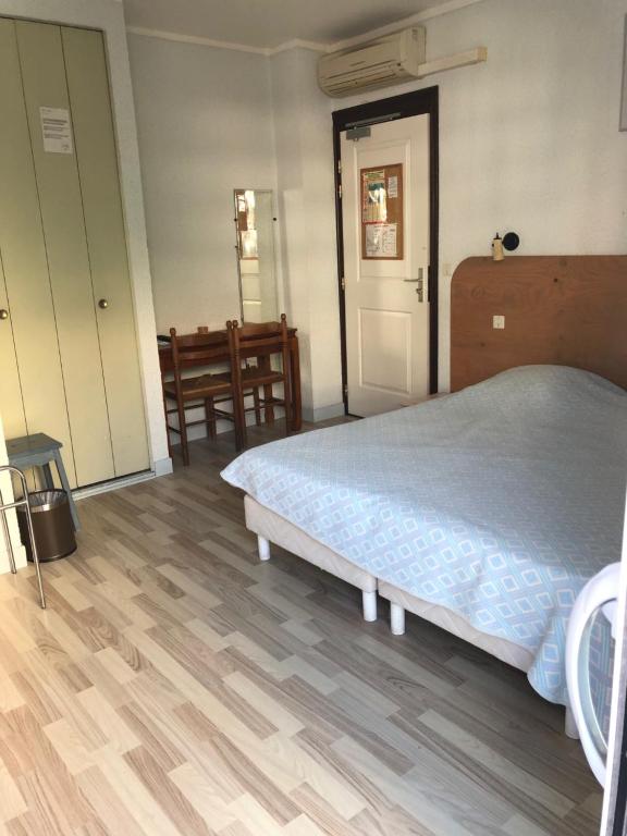 Postel nebo postele na pokoji v ubytování Le Preconil
