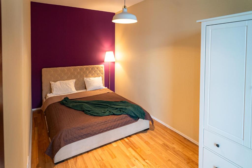Posteľ alebo postele v izbe v ubytovaní Triton Apartments