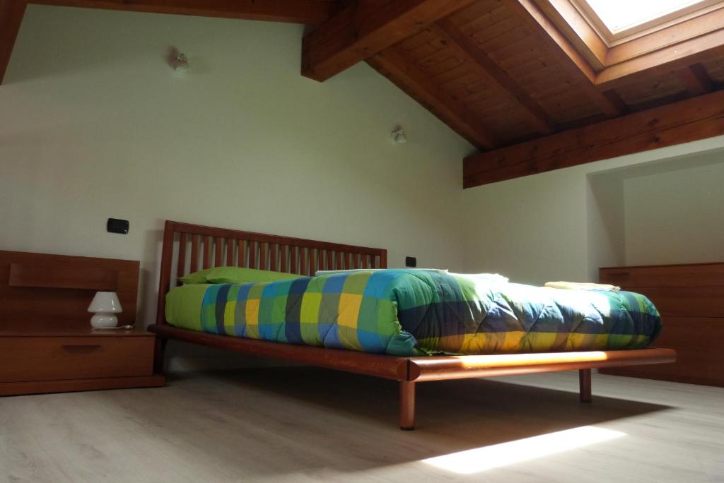 Postel nebo postele na pokoji v ubytování Giardino tra i laghi