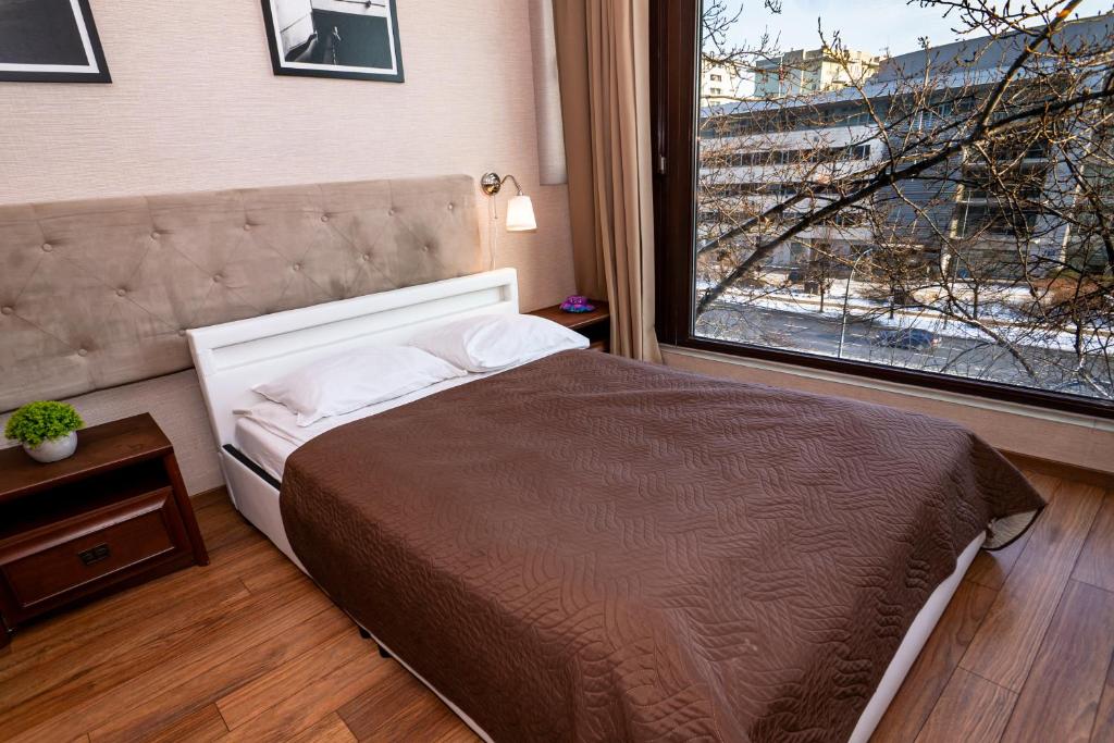 Posteľ alebo postele v izbe v ubytovaní Triton Apartments