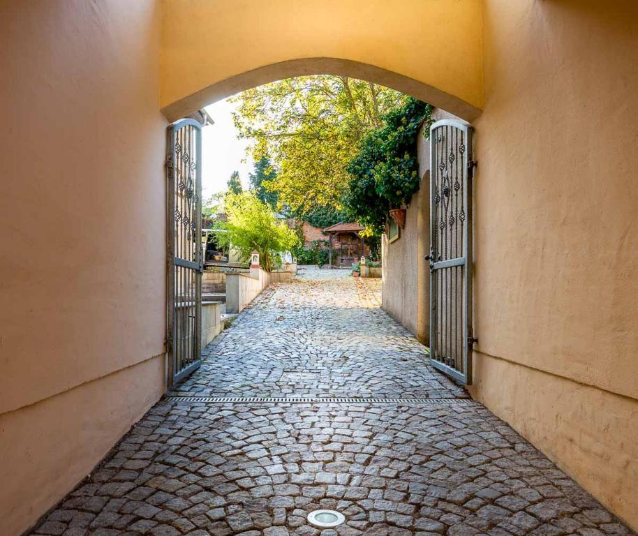 an empty alley with an archway between two buildings at Gästehaus Geiseltalsee in Mücheln