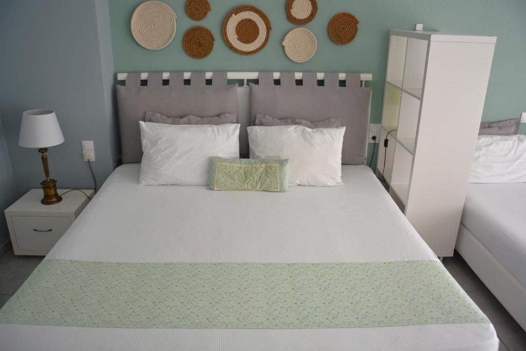 Posteľ alebo postele v izbe v ubytovaní Virginia Rooms