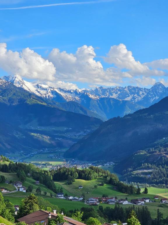 a view of a valley with snow capped mountains at Apartment Alpenblick in Stummerberg