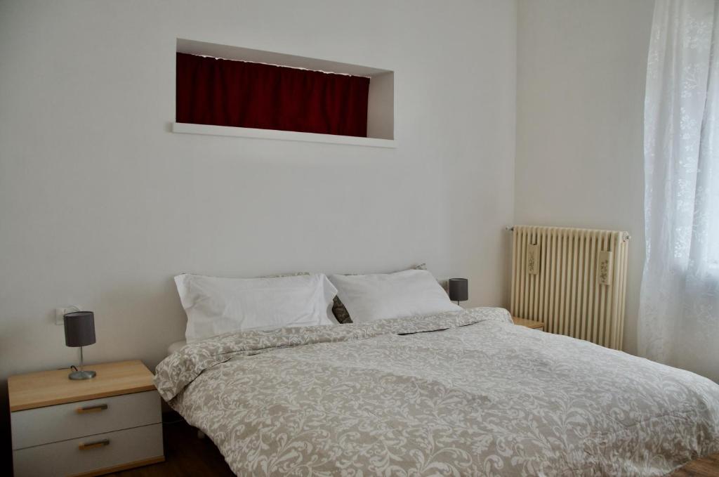 Postel nebo postele na pokoji v ubytování Casa Boller di TSS' - Ideale per Famiglie, Supermercato a 20m & Car Parking