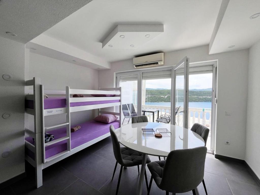 Postel nebo postele na pokoji v ubytování Apartments Mešić