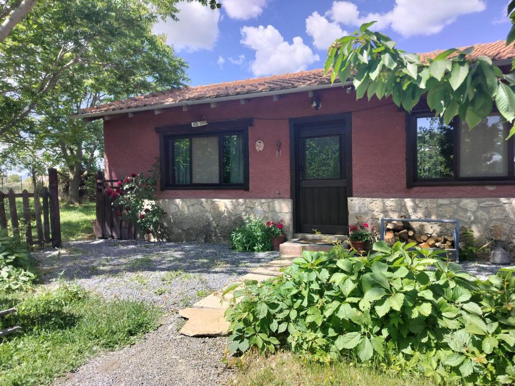 a red house with a black door at Studio Katerina in Florina