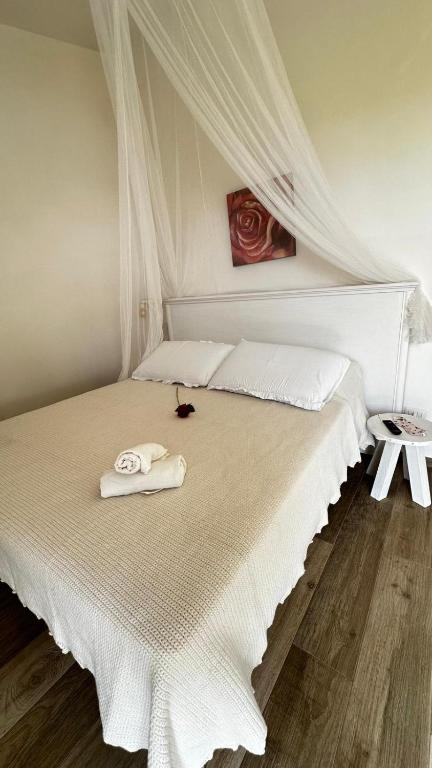Postel nebo postele na pokoji v ubytování Dimora Idruntina