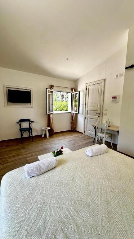 Postel nebo postele na pokoji v ubytování Dimora Idruntina