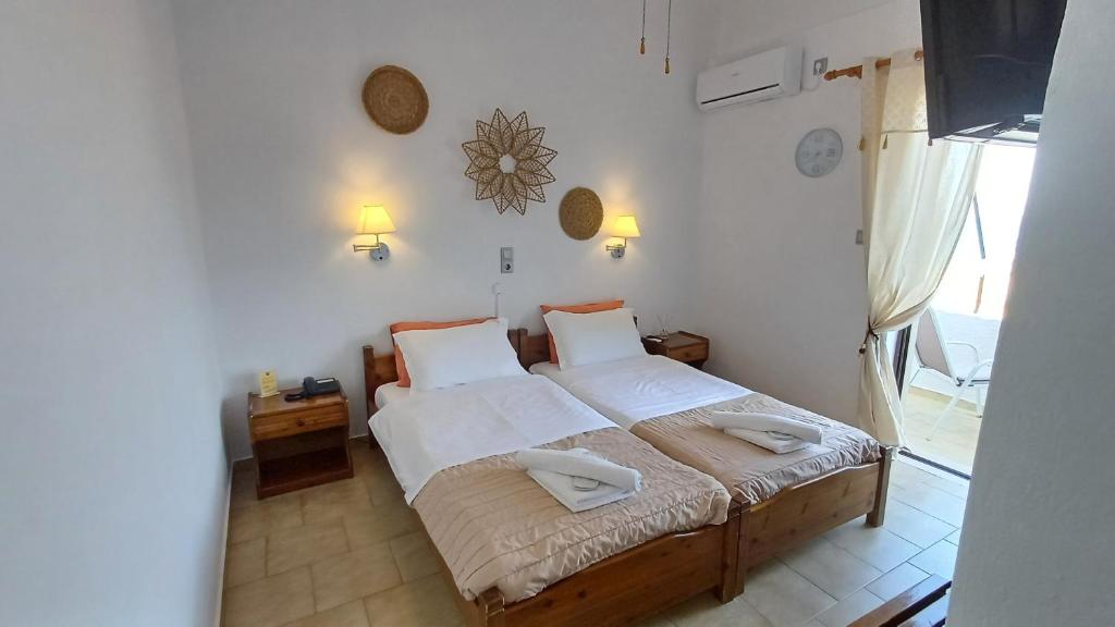 Postel nebo postele na pokoji v ubytování Hotel Beach Amaryllis