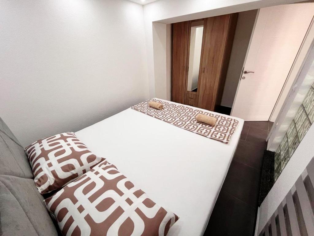 Postel nebo postele na pokoji v ubytování Apartments Mešić