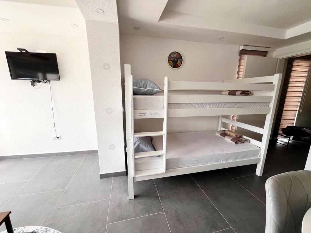 Postel nebo postele na pokoji v ubytování Apartments Mešić