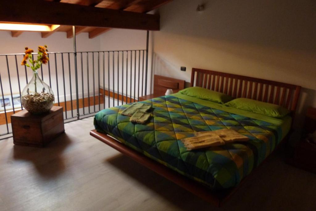 Postel nebo postele na pokoji v ubytování Giardino tra i laghi