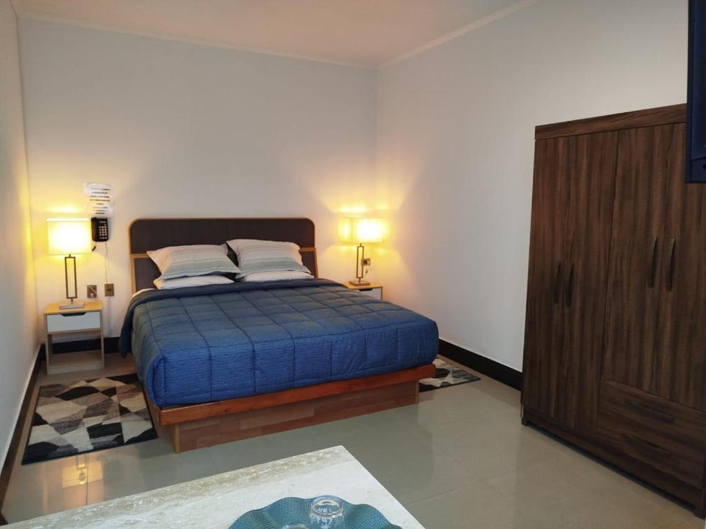 Postel nebo postele na pokoji v ubytování Hotel Ming Shen