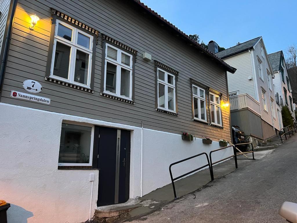 a black and white building on a street at Duży apartament w centrum in Ålesund
