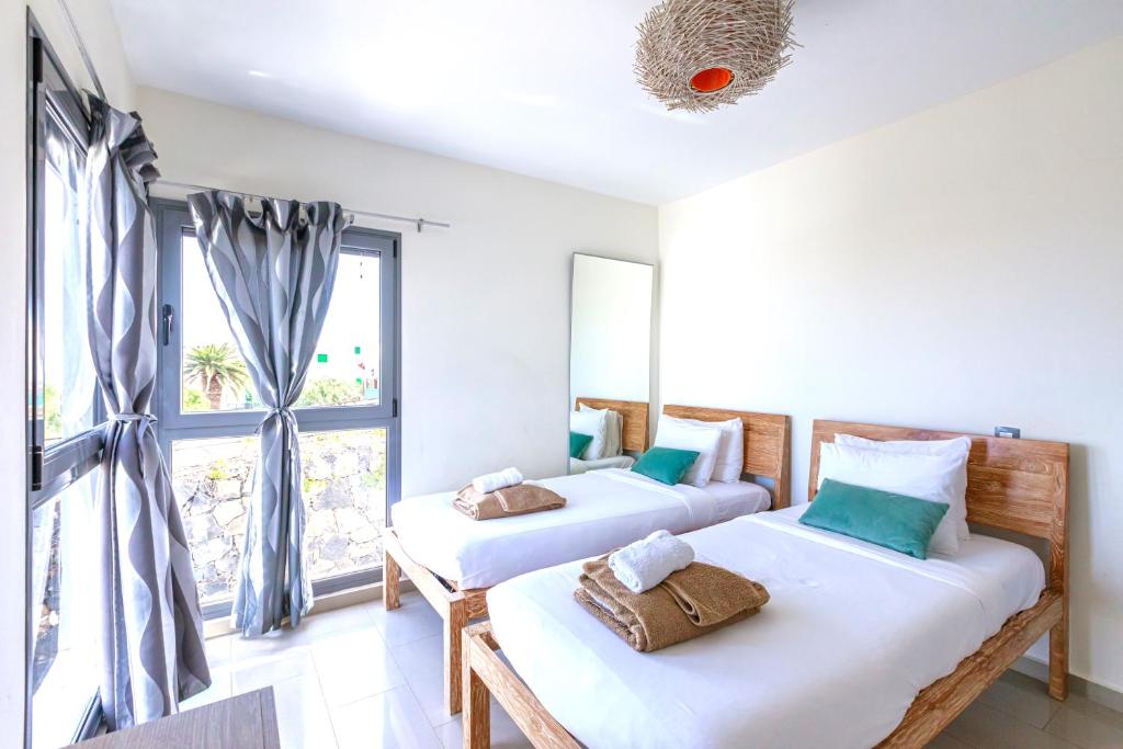 Postel nebo postele na pokoji v ubytování Luxus Villa mit 5 Schlafzimmern, Heated Pool, PS4, Fitnessraum
