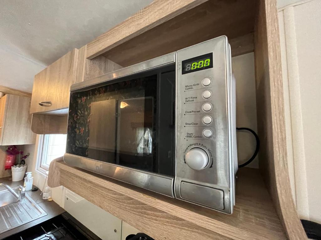 Kuchyň nebo kuchyňský kout v ubytování Boshuisje met sauna in Hoenderloo