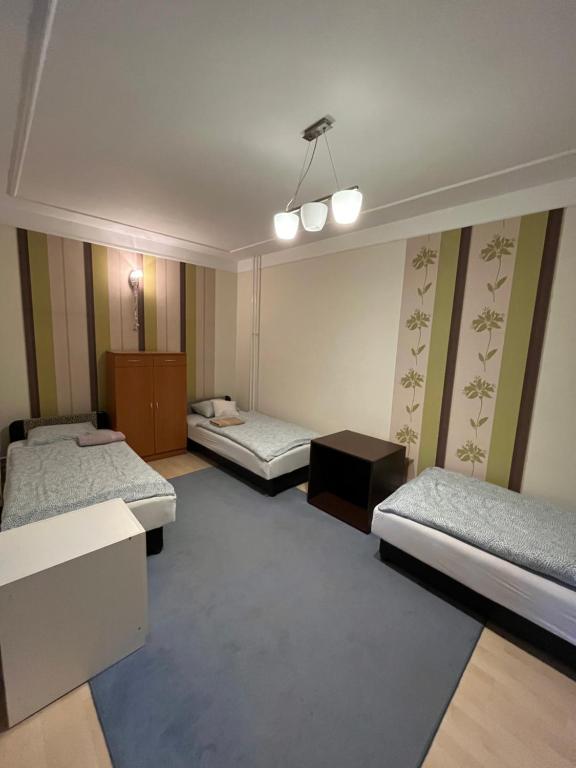 Postel nebo postele na pokoji v ubytování Tocc Apartman
