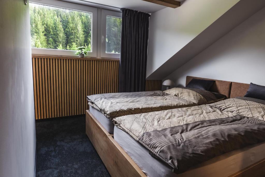 Postel nebo postele na pokoji v ubytování Luxusní Apartmán Domovjanka - SKALKA FAMILY