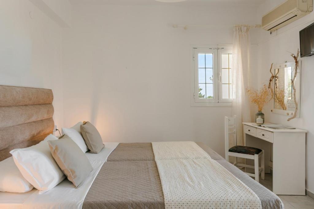 Postel nebo postele na pokoji v ubytování Vivian Apartments