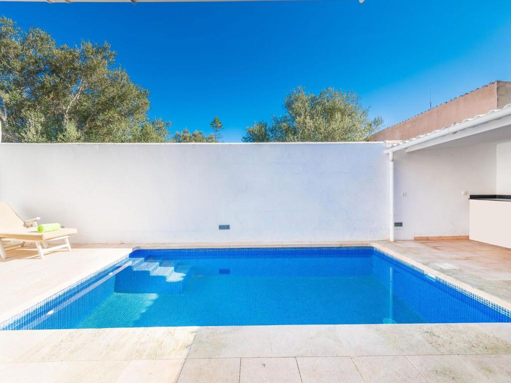 a swimming pool in the backyard of a house at Sestanyolet - Villa With Private Pool In S'estanyol De Migjorn Free Wifi in El Estanyol